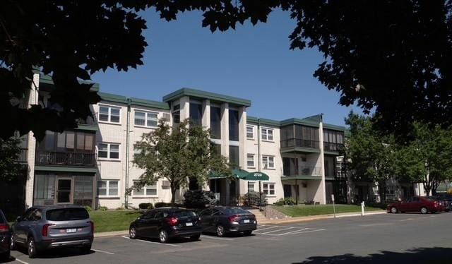 2720 Dale St N Unit C206, Roseville, MN 55113 - view of property featuring uncovered parking