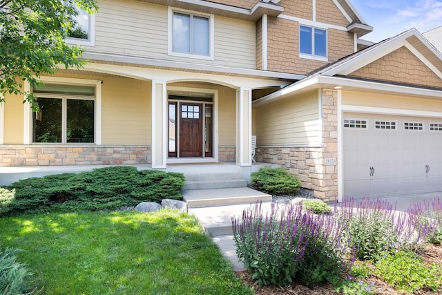 18658 Ponderosa Ct, Eden Prairie, MN 55347 - doorway to property with stone siding, a garage, and covered porch