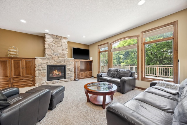 18658 Ponderosa Ct, Eden Prairie, MN 55347 - living area with light carpet, a textured ceiling, recessed lighting, and a fireplace