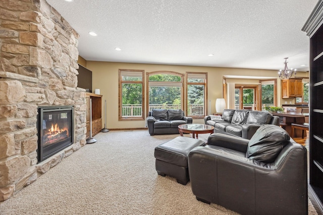 18658 Ponderosa Ct, Eden Prairie, MN 55347 - living room featuring light carpet, a textured ceiling, a stone fireplace, recessed lighting, and healthy amount of natural light
