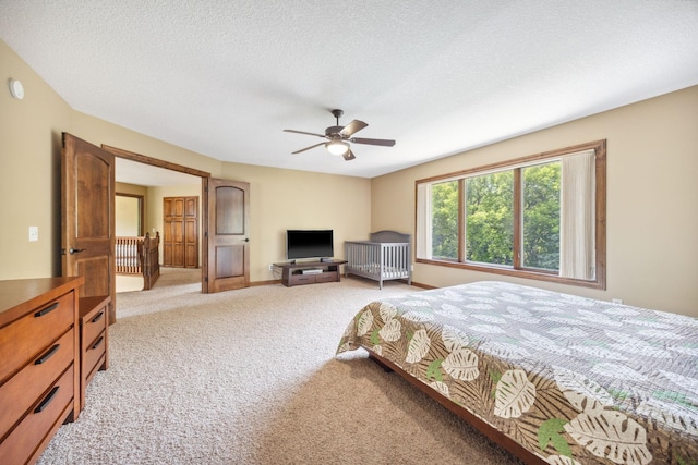 18658 Ponderosa Ct, Eden Prairie, MN 55347 - bedroom featuring light colored carpet, a ceiling fan, and a textured ceiling