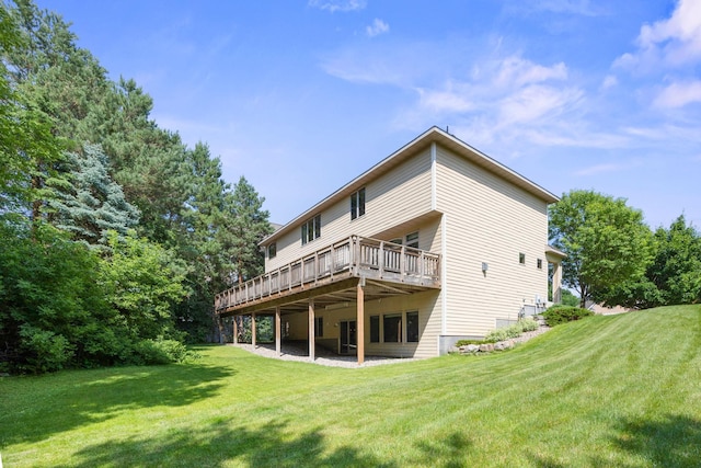 18658 Ponderosa Ct, Eden Prairie, MN 55347 - back of house with a deck and a lawn