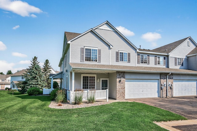 14220 Avalon Path Unit 1102, Rosemount, MN 55068 - townhome / multi-family property with a garage, asphalt driveway, a front yard, covered porch, and a shingled roof