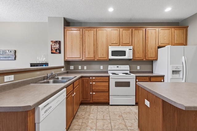 14220 Avalon Path Unit 1102, Rosemount, MN 55068 - kitchen featuring white appliances, a textured ceiling, a peninsula, recessed lighting, and brown cabinetry