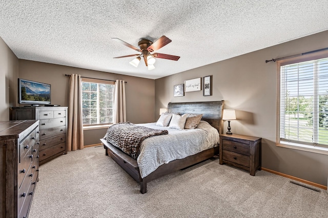 14220 Avalon Path Unit 1102, Rosemount, MN 55068 - bedroom featuring light carpet, a ceiling fan, and a textured ceiling