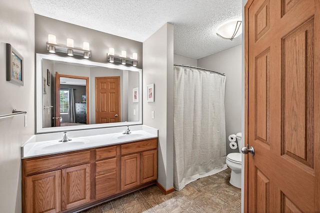 14220 Avalon Path Unit 1102, Rosemount, MN 55068 - full bath with double vanity, a textured ceiling, stone finish flooring, a shower with curtain, and connected bathroom