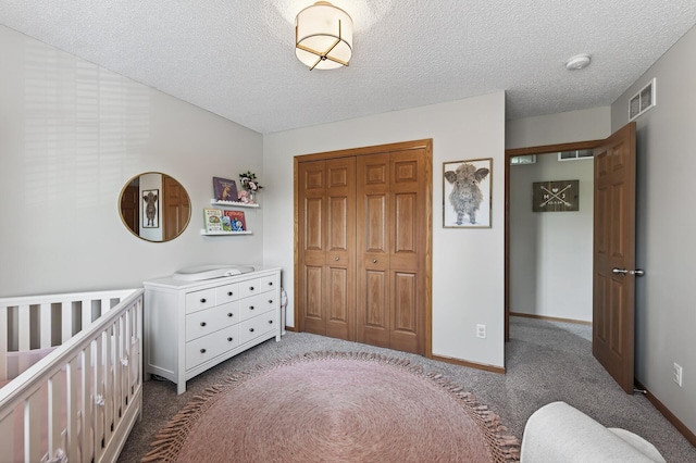 14220 Avalon Path Unit 1102, Rosemount, MN 55068 - bedroom featuring dark carpet, a closet, and a textured ceiling
