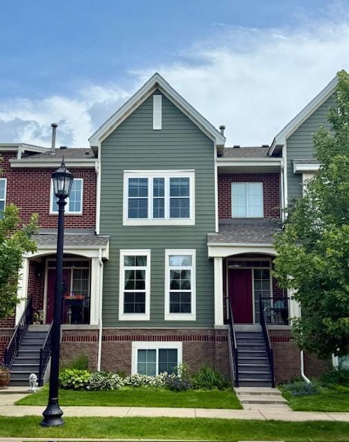 8124 Oakview Ln N Unit 47, Maple Grove, MN 55369 - townhome / multi-family property featuring a porch, brick siding, and stairs