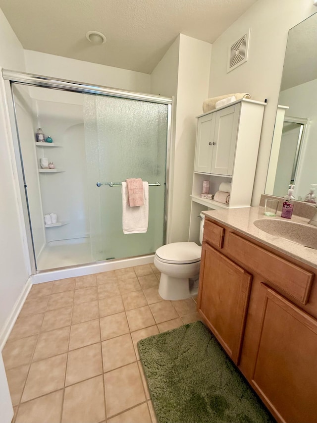 8124 Oakview Ln N Unit 47, Maple Grove, MN 55369 - bathroom featuring a shower stall, vanity, and tile patterned floors