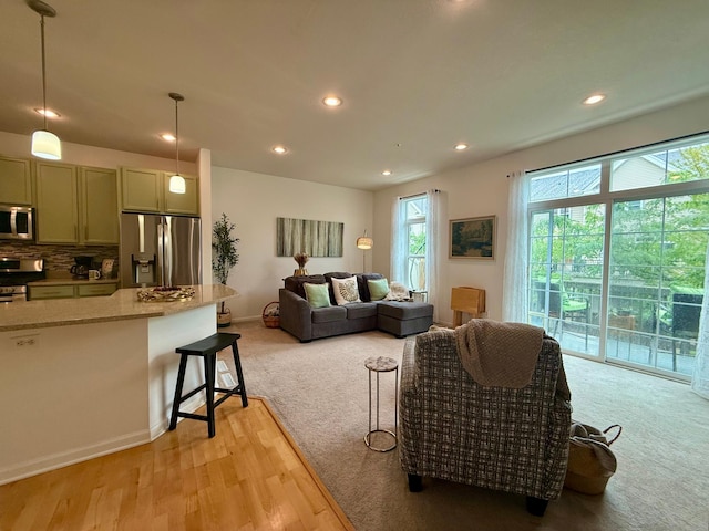 8124 Oakview Ln N Unit 47, Maple Grove, MN 55369 - living room featuring recessed lighting, light colored carpet, and light wood-type flooring