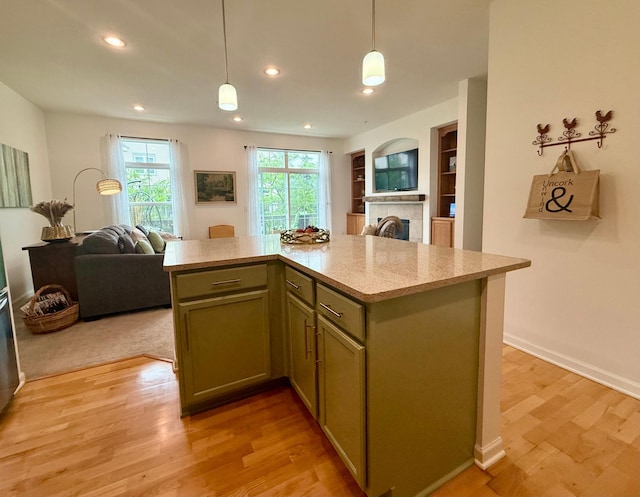 8124 Oakview Ln N Unit 47, Maple Grove, MN 55369 - kitchen featuring open floor plan, a fireplace, decorative light fixtures, light wood finished floors, and recessed lighting