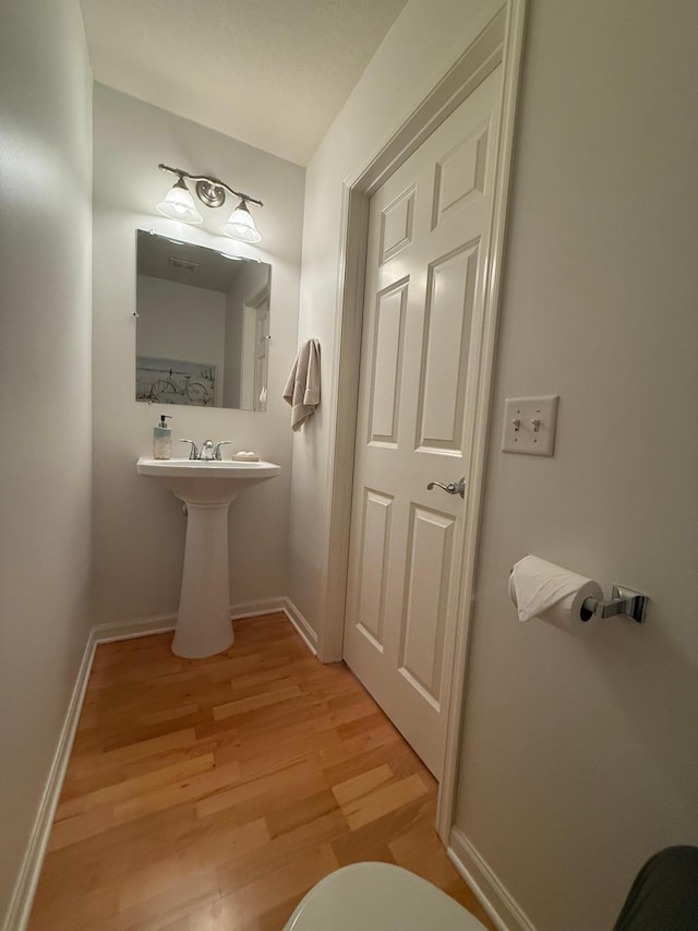 8124 Oakview Ln N Unit 47, Maple Grove, MN 55369 - half bathroom with wood finished floors and baseboards