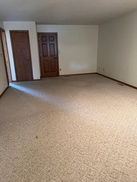 324 7th St, Windom, MN 56101 - spare room featuring baseboards
