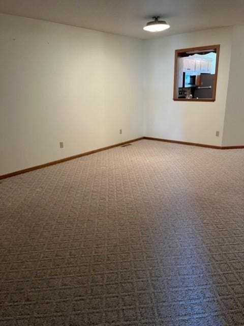 324 7th St, Windom, MN 56101 - empty room featuring carpet flooring