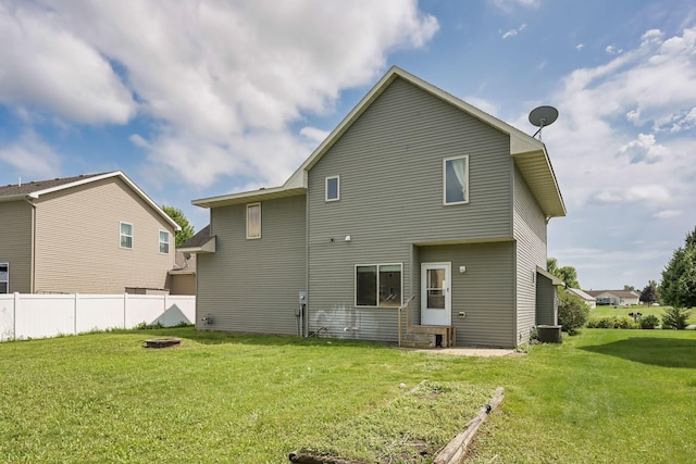 12344 67th St NE, Otsego, MN 55330 - rear view of house featuring entry steps and a fire pit