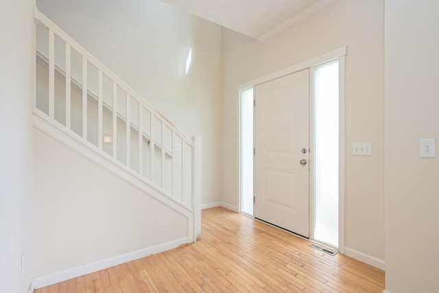12344 67th St NE, Otsego, MN 55330 - entryway featuring light wood-style flooring and stairs
