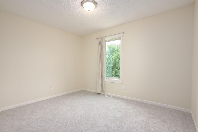 12344 67th St NE, Otsego, MN 55330 - carpeted spare room featuring a textured ceiling and baseboards