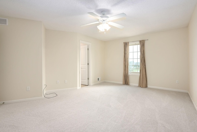 12344 67th St NE, Otsego, MN 55330 - spare room with a ceiling fan, light carpet, and a textured ceiling
