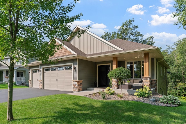29680 Hidden Forest Blvd, Chisago City, MN 55013 - craftsman-style house with board and batten siding, stone siding, an attached garage, and a front yard