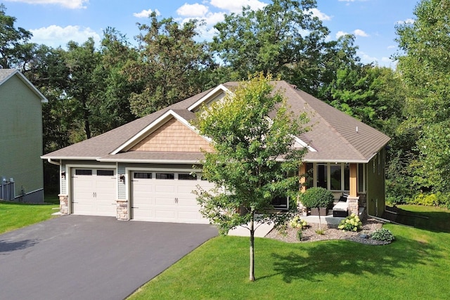 29680 Hidden Forest Blvd, Chisago City, MN 55013 - view of front of house with driveway, a front yard, an attached garage, and stone siding