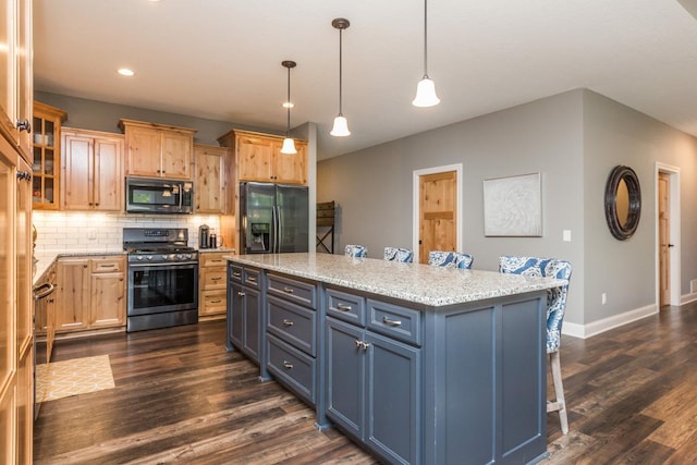 29680 Hidden Forest Blvd, Chisago City, MN 55013 - kitchen with stainless steel range with gas cooktop, black refrigerator with ice dispenser, dark wood-style floors, backsplash, and a center island