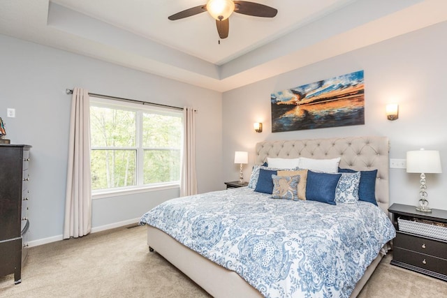 29680 Hidden Forest Blvd, Chisago City, MN 55013 - carpeted bedroom featuring a tray ceiling and ceiling fan