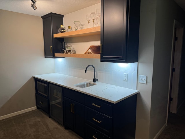 29680 Hidden Forest Blvd, Chisago City, MN 55013 - kitchen featuring open shelves, wine cooler, light stone counters, dark carpet, and decorative backsplash
