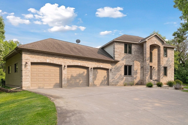 4584 162nd Ln NW, Andover, MN 55304 - view of front of property featuring driveway, brick siding, a garage, and a shingled roof