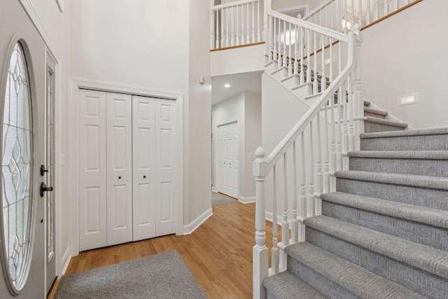 4584 162nd Ln NW, Andover, MN 55304 - foyer entrance featuring stairway, a high ceiling, and wood finished floors