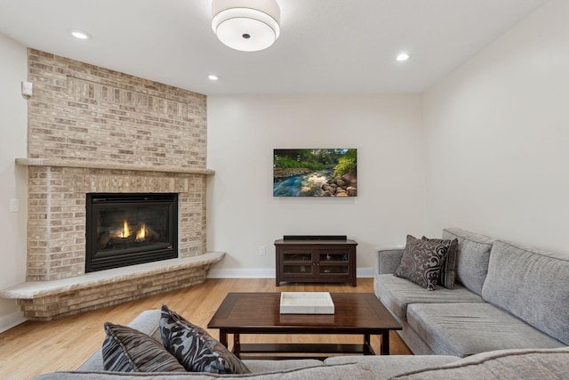 4584 162nd Ln NW, Andover, MN 55304 - living area featuring wood finished floors, a brick fireplace, and recessed lighting