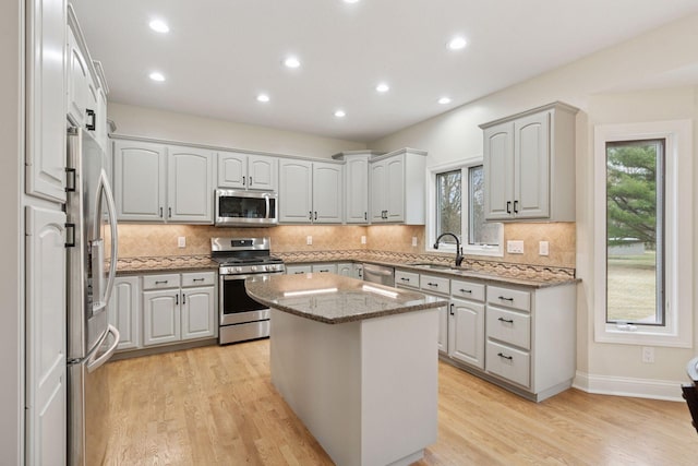 4584 162nd Ln NW, Andover, MN 55304 - kitchen with appliances with stainless steel finishes, healthy amount of natural light, tasteful backsplash, and recessed lighting