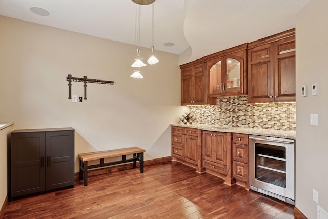 4584 162nd Ln NW, Andover, MN 55304 - bar featuring wine cooler, decorative backsplash, dark wood-style flooring, decorative light fixtures, and vaulted ceiling