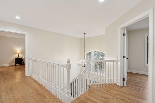 4584 162nd Ln NW, Andover, MN 55304 - hall with an upstairs landing, wood finished floors, recessed lighting, and a chandelier