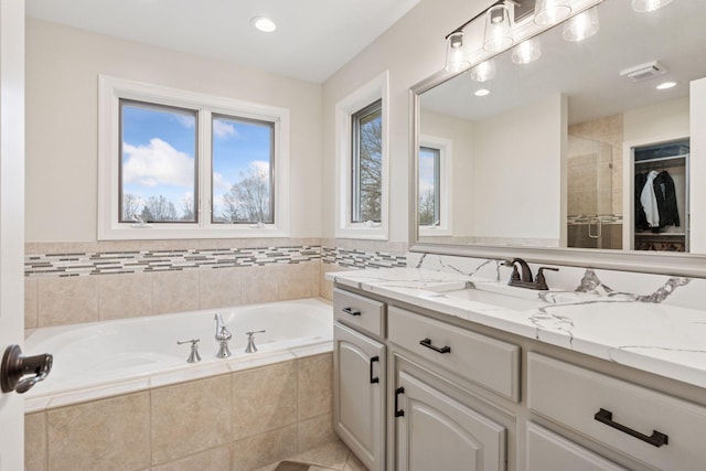4584 162nd Ln NW, Andover, MN 55304 - bathroom with vanity, a bath, and recessed lighting
