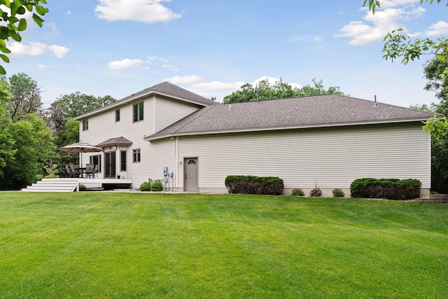 4584 162nd Ln NW, Andover, MN 55304 - rear view of house with a lawn, a wooden deck, and a shingled roof