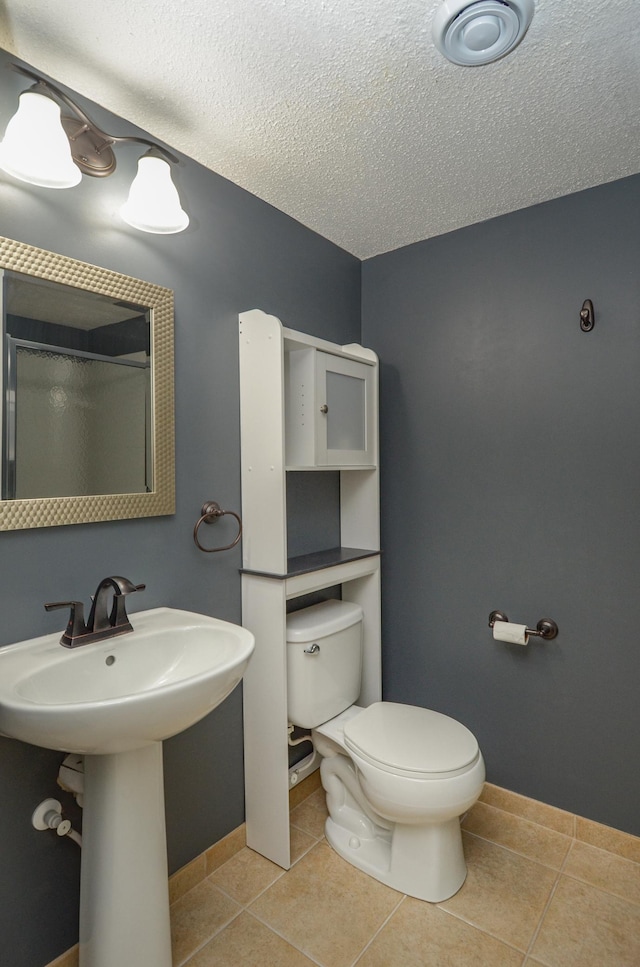 8397 Norwood Ln N, Maple Grove, MN 55311 - full bath with a textured ceiling, tile patterned flooring, and a shower