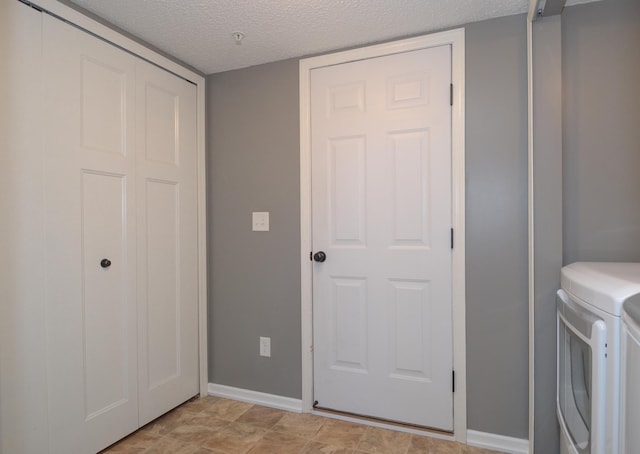 8397 Norwood Ln N, Maple Grove, MN 55311 - washroom with washing machine and dryer and a textured ceiling