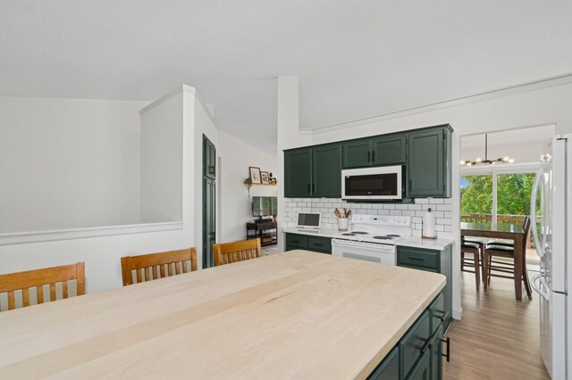 409 Birch Ave NW, Saint Michael, MN 55376 - kitchen featuring white appliances, green cabinets, light countertops, tasteful backsplash, and light wood-style flooring