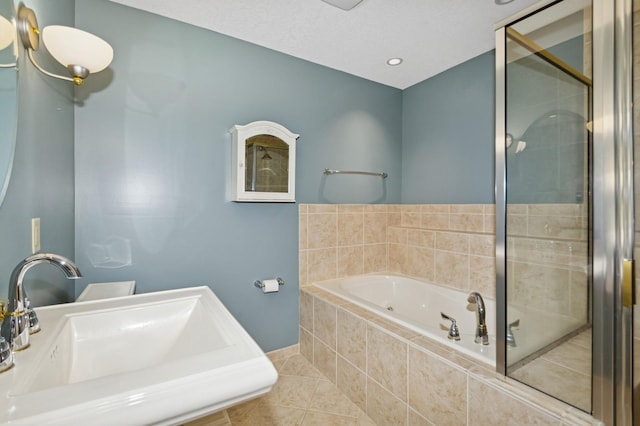 409 Birch Ave NW, Saint Michael, MN 55376 - bathroom with a garden tub, a stall shower, and tile patterned floors