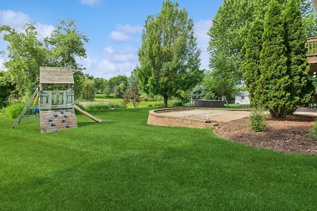409 Birch Ave NW, Saint Michael, MN 55376 - view of green lawn with a playground