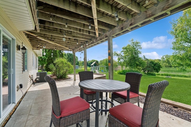 409 Birch Ave NW, Saint Michael, MN 55376 - view of patio featuring a playground and outdoor dining space