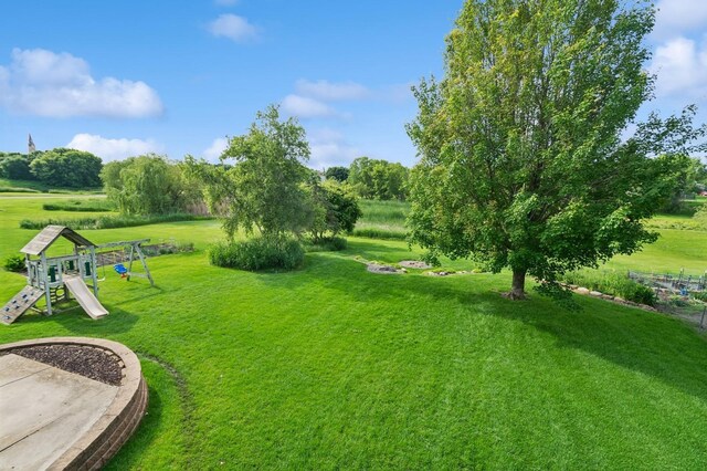 409 Birch Ave NW, Saint Michael, MN 55376 - view of green lawn featuring a playground