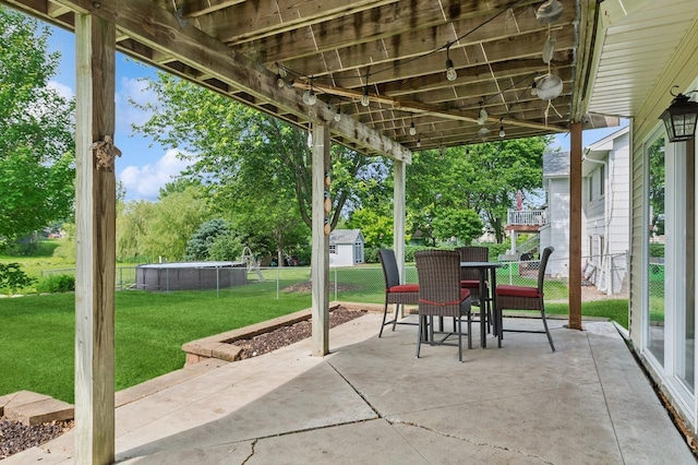 409 Birch Ave NW, Saint Michael, MN 55376 - view of patio with outdoor dining space and an outdoor pool