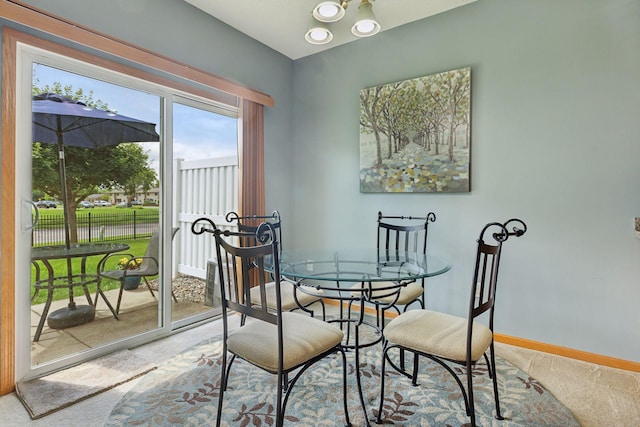 7308 Unity Ln N, Brooklyn Park, MN 55443 - dining space featuring light colored carpet and baseboards