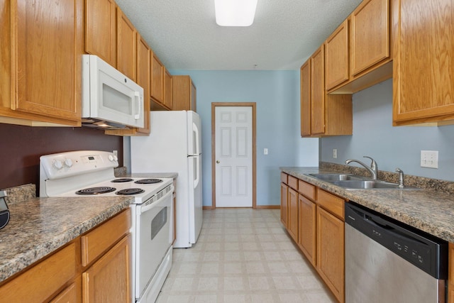 7308 Unity Ln N, Brooklyn Park, MN 55443 - kitchen with white appliances, light floors, and a textured ceiling