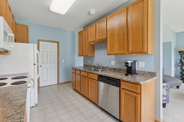 7308 Unity Ln N, Brooklyn Park, MN 55443 - kitchen featuring white appliances, light flooring, and a textured ceiling
