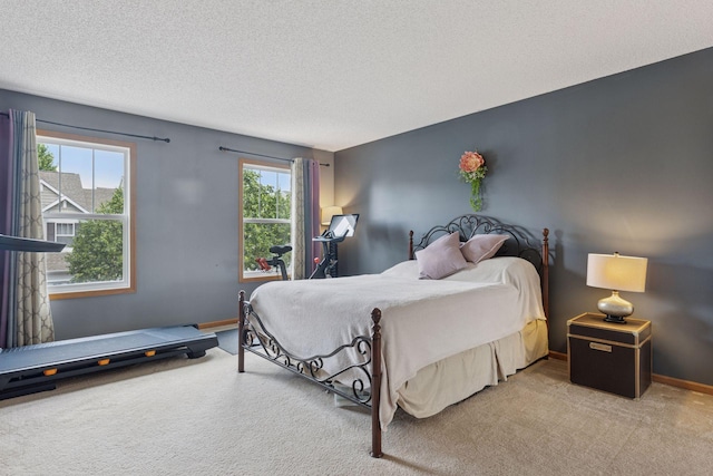 7308 Unity Ln N, Brooklyn Park, MN 55443 - carpeted bedroom with a textured ceiling and baseboards