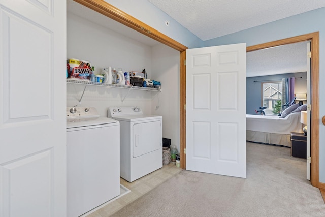 7308 Unity Ln N, Brooklyn Park, MN 55443 - washroom with washing machine and clothes dryer, light colored carpet, and a textured ceiling