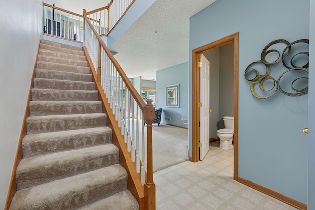 7308 Unity Ln N, Brooklyn Park, MN 55443 - stairs featuring tile patterned floors and carpet floors
