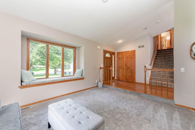 25 Piccadilly Pl, Mankato, MN 56001 - unfurnished living room featuring carpet, stairway, and lofted ceiling